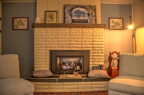 Gas fireplace for cozy evenings. Extra seating, books, games nearby.