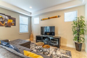 Living room with 55-Inch smart TV and Xbox one console