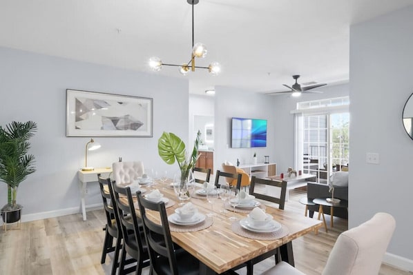 Modern open concept of living room, dining room and kitchen with island!#Disney #Theme #Parks #Magic #kingdom #springs #SecretLake #Apartment #Vacation #Rental #waterpark #Kissimmee #Orlando #Universal #Citywalk
