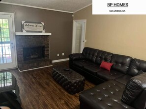 Living area:   Leather sectional, fireplace and a 75" smart TV on wall