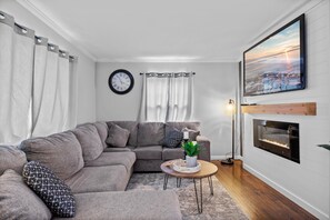 Main floor living room with electric fireplace