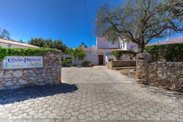 Entrance Casa das Primas.  Entrance to the Every Lodge in front of pepper tree