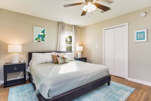 Our luxurious primary bedroom boasts a king-sized bed and SmartTV for ultimate relaxation.