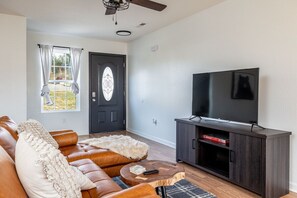 Cozy vibes and movie nights await in this living room! Grab your favorite snacks and let the binge-watching begin!