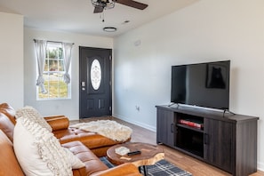 Cozy vibes and movie nights await in this living room! Grab your favorite snacks and let the binge-watching begin!