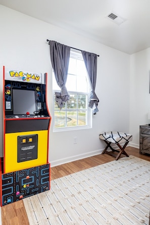 Game on! This room is the ultimate hangout spot, where epic battles and movie marathons come to life. Who's ready to level up the fun?