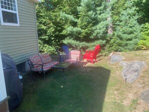 Outdoor sitting area on the side of cottage