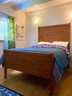 Master bedroom with antique leaf engraved full/double size bed