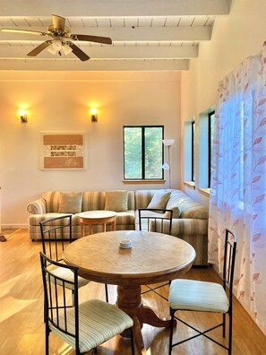Open living area with many windows