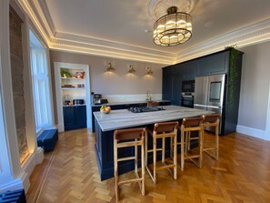 The Kitchen includes an extra large island with hand picked Brazilian granite worktops