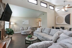 Spacious Living Room with High Ceilings,  Skylights and plenty of seating
