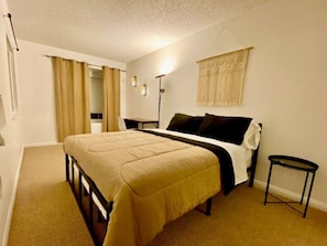 Your second bedroom perfect to rest in your queen bed or work at your dedicated workspace!