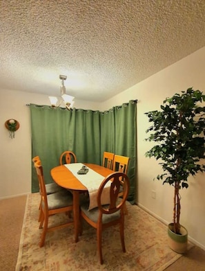 Directly past your stunning living room is your dining space waiting for your next meal!