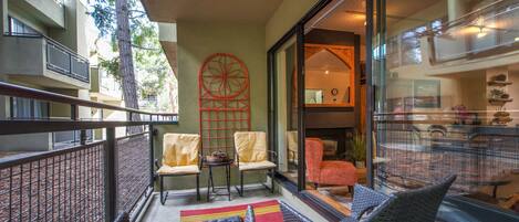 Outdoor Patio: "Inviting outdoor space with four chairs and a red carpet.