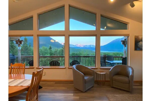 Living room looking out onto deck with amazing views 