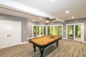 The panoramic game room offers Pool & more (yard games stored in the closet).