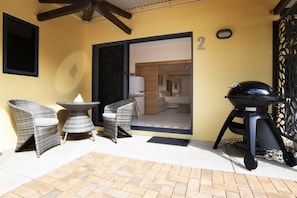 Latitude 17 - Suite 2 - Entry door with seating and BBQ