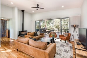 Cosy up on the leather lounges in the living area with a spot of TV.