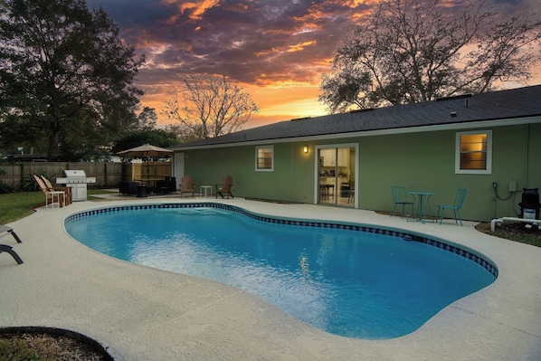 Charming backyard oasis with a pool, cozy seating, and sunset views perfect for relaxing or entertaining.

This home is recommended for swimmers only>>