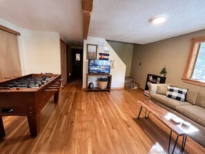 Family room on the first floor with games and smart TV