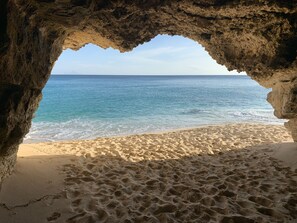 Coral cave on our secluded beach. Kids love to search for pirate treasure.