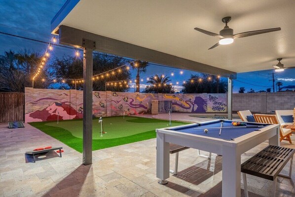 Play some pool, cornhole or golf in the backyard.