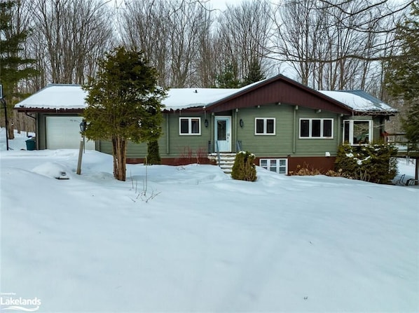 Charming panabode log cabin nestled in the woods in Pretty River Valley.