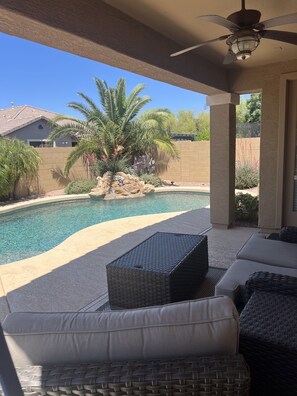 Relaxing outdoor furniture under the covered patio.