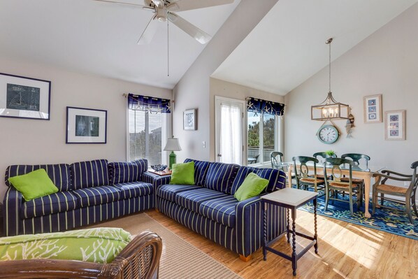 Gather around the Flat Screen TV for an evening night of movies and snacks in the spacious Living Area with high, vaulted ceilings and access to the Furnished Sun Deck.