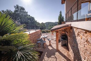 Outside: Heated swimming pool - Terraces - Plancha - Table for 14 people - Sofa - Table tennis - Play area with tree house, trampoline, swing and slide - Petanque pitch + boules.