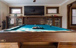 Who wants to play pool? We got you covered and a large Smart TV to catch up on all the sports games