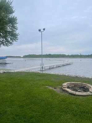 View from back yard with pier and fire pit