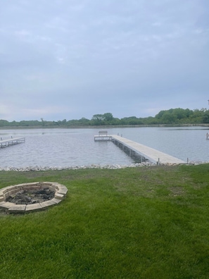 View from back yard with pier and fire pit