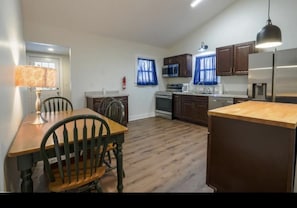 Large kitchen with eating area and cooking prep area. Washer dryer included