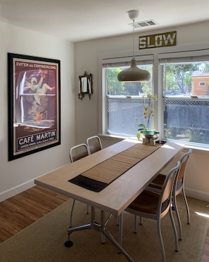 Dining table for 4 w/side yard view. Enjoy a delicious meal or a morning coffee
