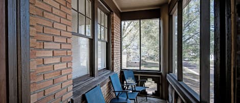 Sitting on the front, screened in porch.