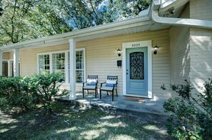 The front of the house with outdoor seating.