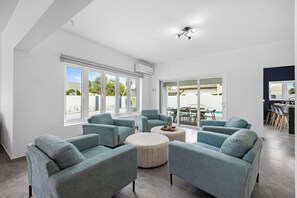 Clean and bright living room space with a cozy sofa.