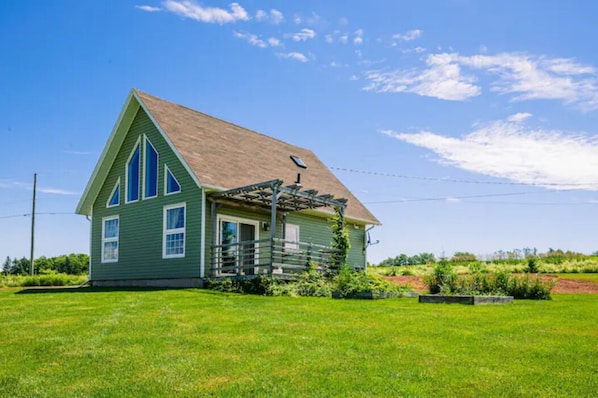 The cottage in the summer. Looking East.