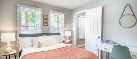 Lower Bedroom #1- Queen bed with vanity/desk and walk in closet