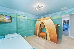 Moana Room sleeps 3 with custom beds, murals, 32" TV, and passage to kids room