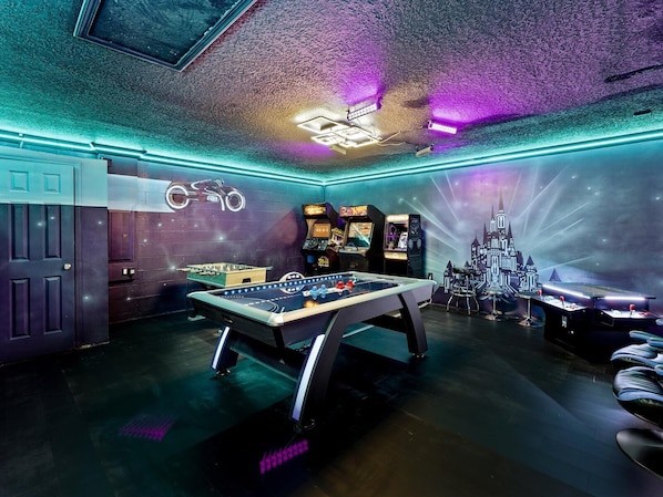 Tron Game Room with air hockey, foosball, Tron & 3 arcade games, & Xbox.
