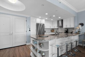 Bar seating along granite countertop 