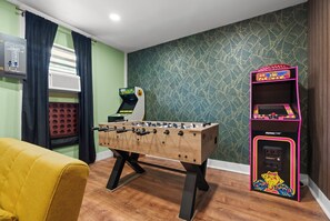 Discover the secret game room w/ arcades, foosball, smart TV & 2 pullout sofas!