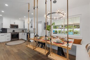 Level up your dining experience at this indoor dining space -complete with hanging swings!