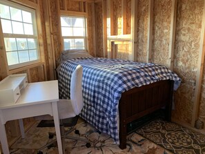 Twin bed and pop up twin bed underneath 