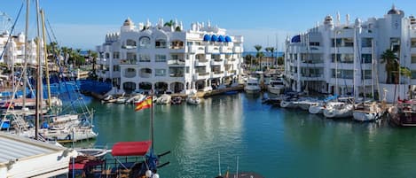 Water, Boat, Building, Sky, Property, Watercraft, Azure, Lake, Vehicle