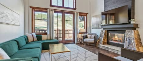 Cozy living room with slope side views.