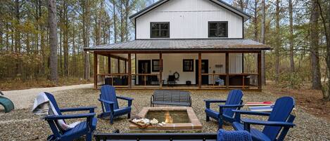 Roast some marshmallows in the backyard fire pit. Plenty of seating for everyone and close to what you need inside the cabin. Steps off of the back deck with hot tub and nearby playset.