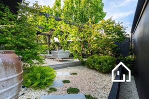 The property features a expansive north facing deck (pictured here in Spring)